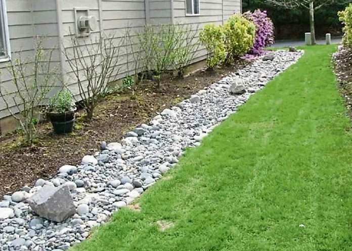 Detail of dense planting softening the walls of an inner courtyard